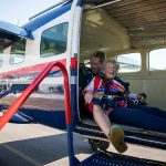 Kim Knor smiles after loading up into the airplane on Wednesday, Aug. 14, 2024 in Sultan, Washington. (Olivia Vanni / The Herald)