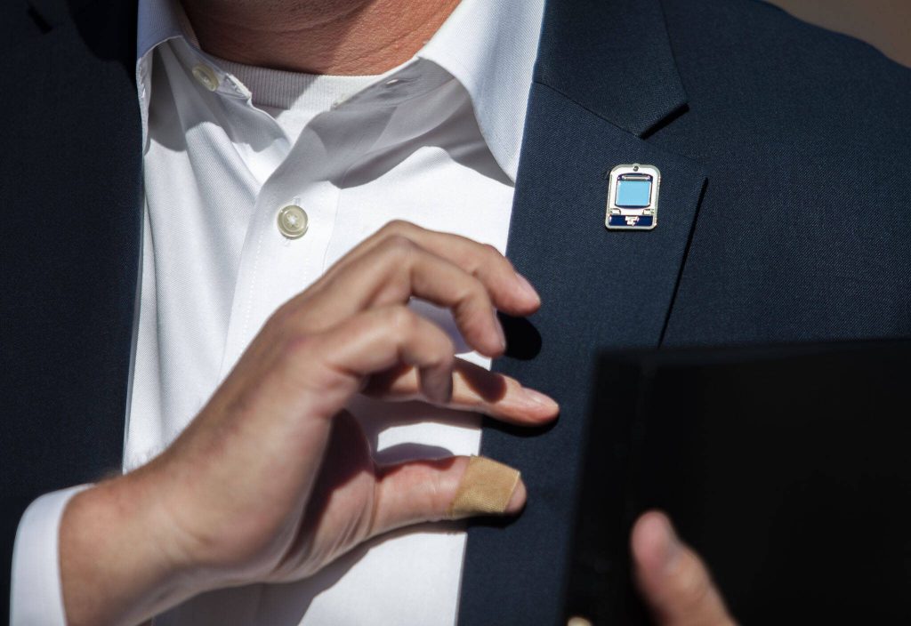 A person wears a Link light rail train pin on Wednesday, Aug. 28, 2024 in Lynnwood, Washington. (Olivia Vanni / The Herald)