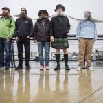 People wait to have their beards measured in a Guinness World Record Beard Chain Attempt at Pacific Rim Plaza on Friday, Nov. 1, 2024 in Everett, Washington. (Olivia Vanni / The Herald)