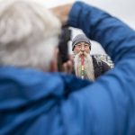 Jeff Raye, from Austin, Texas, has his photo taken with a measuring stick for proof of beard length for the Guinness World Record Beard Chain Attempt on Friday, Nov. 1, 2024 in Everett, Washington. (Olivia Vanni / The Herald)