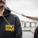 A clip holds together two beards during the Guinness World Record Beard Chain Attempt on Friday, Nov. 1, 2024 in Everett, Washington. (Olivia Vanni / The Herald)
