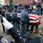 Washington State Trooper Chris Gadd is transported inside prior to a memorial service in his honor Tuesday, March 12, 2024, at Angel of the Winds Arena in Everett, Washington. (Ryan Berry / The Herald)