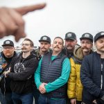 Dozens of people with mustaches clipped wait to be measured for a Guinness World Record Mustache Chain Attempt on Friday, Nov. 1, 2024 in Everett, Washington. (Olivia Vanni / The Herald)