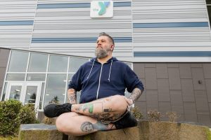 Christopher Bragg outside of the Everett YMCA on Thursday, Feb. 20, 2025 in Everett, Washington. (Olivia Vanni / The Herald)