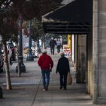 Two couples walk along Hewitt Avenue around lunchtime on Wednesday, Oct. 19, 2022 in Everett, Washington. (Olivia Vanni / The Herald)