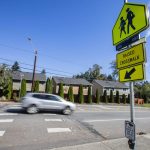 A car drives along Lockwood Road in front of Lockwood Elementary School on Monday, Sept. 30, 2024 in Bothell, Washington. (Olivia Vanni / The Herald)