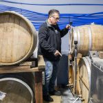 Robert Thompson talks about the different alcohols aging in barrels. (Olivia Vanni / The Herald)