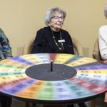 Mary Ann Karber, 101, spins the wheel during Wheel of Fortune at Washington Oakes in Everett. (Olivia Vanni / The Herald)