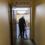 Mary Ann Karber walks into the game room at Washington Oakes in Everett. (Olivia Vanni / The Herald)