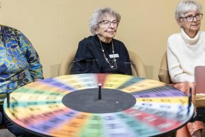 Mary Ann Karber, 101, spins the wheel during Wheel of Forunte at Washington Oakes on Tuesday, April 1, 2025 in Everett, Washington. (Olivia Vanni / The Herald)