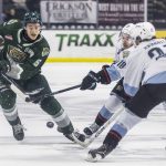 Everett Silvertips defenseman Eric Jamieson maneuvers around the outstretched stick of Portland Winterhawks Kyle McDonough during game seven of the second round of the WHL playoffs on Tuesday, April 22, 2025 in Everett, Washington. (Olivia Vanni / The Herald)