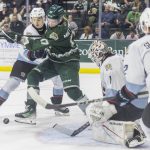 Everett Silvertips forward Julius Miettinen scrambles for a loose puck in front of the goal during game seven of the second round of the WHL playoffs against the Portland Winterhawks on Tuesday, April 22, 2025 in Everett, Washington. (Olivia Vanni / The Herald)