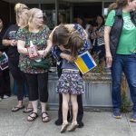 Student Azhura Brown, 5, hugs teacher Anzhelika Huliar on Wednesday, June 25, 2025 in Everett, Washington. (Olivia Vanni / The Herald)