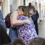 Teacher Pattie Fritts receives a hug from Early Learning Center students parent Stephanie Henifin on the last day of school on Wednesday, June 25, 2025 in Everett, Washington. (Olivia Vanni / The Herald)