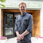 The Crumpet Shop owner Cooper Golding outside of their new location on Tuesday, June 24, 2025 in Edmonds, Washington. (Olivia Vanni / The Herald)