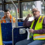 Community Transit CEO Ric Ilgenfritz, right, speaks with other Community Transit leaders during an interview with the Herald on a new electric bus Monday, May 13, 2024, at the Community Transit Operations Base in Everett, Washington. (Ryan Berry / The Herald)