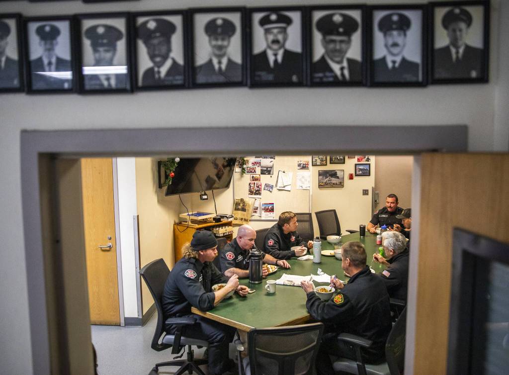 Everett Fire Station One firefighters gather for dinner. (Olivia Vanni / The Herald)
Everett Fire Station One firefighters gather for dinner. (Olivia Vanni / The Herald)