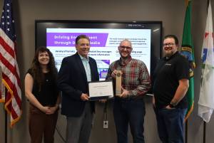 Provided photo
Snohomish County Auditor Garth Fell (middle left) and Elections division staff stand with the Independence Award from the National Association of Election Officials.