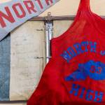 A binder, a track jersey and a pennant flag the school found and received on Tuesday, Sept. 9, 2025 in Everett, Washington. (Olivia Vanni / The Herald)