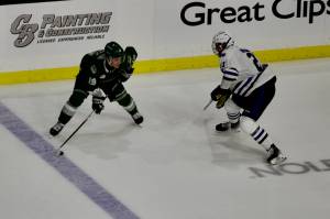 Silvertips forward Zackary Shantz looks for a pass around Wild defenseman Darian Rolsing during Everett's 4-3 shootout win against Wenatchee at Angel of the Winds Arena on Sept. 20, 2025. Shantz had a natural hat trick to overcome a 3-0 deficit and force overtime. (Joe Pohoryles / The Herald)