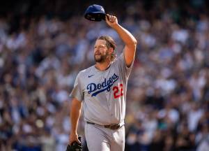 Starting pitcher Clayton Kershaw (22) of the Los Angeles Dodgers acknowledges fans as he walks off the field during the sixth inning of a game against the Seattle Mariners at T-Mobile Park on Sunday, Sept. 28, 2025, in Seattle. (Stephen Brashear / Getty Images/ Tribune News Services)