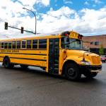 An Everett school bus crosses Hewitt Avenue as it travels north on Cedar Street on Wednesday, Oct. 1, 2025, in Everett, Washington. (Aaron Kennedy / The Herald)