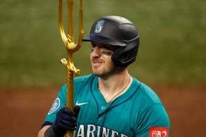 Mitch Garver (18) of the Seattle Mariners celebrates after hitting a two-run home run against the Texas Rangers during the 12th inning at Globe Life Field on Sunday, June 29, 2025, in Arlington, Texas. (Ron Jenkins / Getty Images / Tribune News Services)