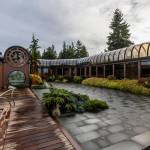 The back patio area and deck of the $6 million glass house for sale on Oct. 23, 2025 in Mukilteo. (Olivia Vanni / The Herald)