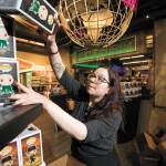 Cassie Smith, inventory manager, stocks shelves with the new Marvel 80th First Appearance Vulture Pop! Vinyl Figure at the Funko store on Wetmore Avenue on Thursday, Jan. 23, 2020, in Everett, Washington. (Andy Bronson / The Herald)