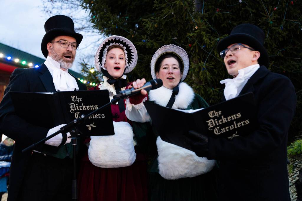Carolers sing at the Tulalip Lights and Ice event on November 22, 2025 in Tulalip, Washington. (Will Geschke / The Herald)