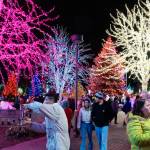 Visitors walk while looking at lights at the Tulalip Lights and Ice event on Saturday in Tulalip. (Will Geschke / The Herald)