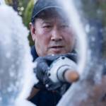 Kitburi makes small adjustments to his ice sculpture while he works on Sept. 17, 2025 in Marysville, Washington. (Olivia Vanni / The Herald)
