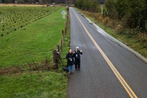 Water from the Snohomish River spills onto a road on Thursday, Dec. 11, 2025 in Snohomish, Washington. (Olivia Vanni / The Herald)