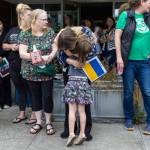 Student Azhura Brown, 5, hugs teacher Anzhelika Huliar on Wednesday, June 25, 2025, in Everett, Washington. (Olivia Vanni / The Herald)