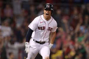 Rob Refsnyder of the Boston Red Sox celebrates after driving in the winning run during the ninth inning against the Texas Rangers at Fenway Park on Thursday, Sept. 1, 2022, in Boston. (Paul Rutherford / Getty Images / Tribune News Services)