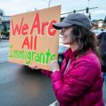 In a gathering similar to many others across the nation on Presidents Day, hundreds lined Broadway with their signs and chants to protest the Trump administration Monday evening in Everett. (Aaron Kennedy / Daily Herald)