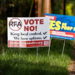Signs in support of and in opposition of the Proposition 1 annexation into RFA are visible along 100th Avenue West on Thursday, April 3, 2025, in Edmonds, Washington. In April, voters approved annexation into South County Fire. As a result, the median homeowner will see property taxes increase by about $65 per month, or $780 per year.(Olivia Vanni / The Herald)
