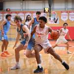 Everett freshman Noah Parker drives past Spokane sophomore Eloy Chaparro during the Trojans' 93-92 overtime loss to the Sasquatch at Walt Price Student Fitness Center on Jan. 3, 2026. (Daniel Acosta / Everett CC)