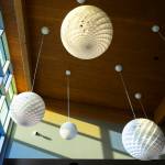 Sun shines through colored glass inside the new Lynnwood Neighborhood Center on Friday, Jan. 9, 2026 in Lynnwood, Washington. (Olivia Vanni / The Herald)