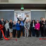 President and CEO of Volunteers of America of Western Washington Brian Smith cut a ribbon during the opening of the Lynnwood Neighborhood Center on Friday, Jan. 9, 2026 in Lynnwood, Washington. (Olivia Vanni / The Herald)