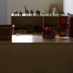 A row of toy dinosaurs sit on a shelf inside the early learning room in the Lynnwood Neighborhood Center on Friday, Jan. 9, 2026 in Lynnwood, Washington. (Olivia Vanni / The Herald)