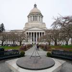 The sun dial near the Legislative Building is shown under cloudy skies in March 2022, at the state Capitol in Olympia. (Ted S. Warren / associated Press file photo)