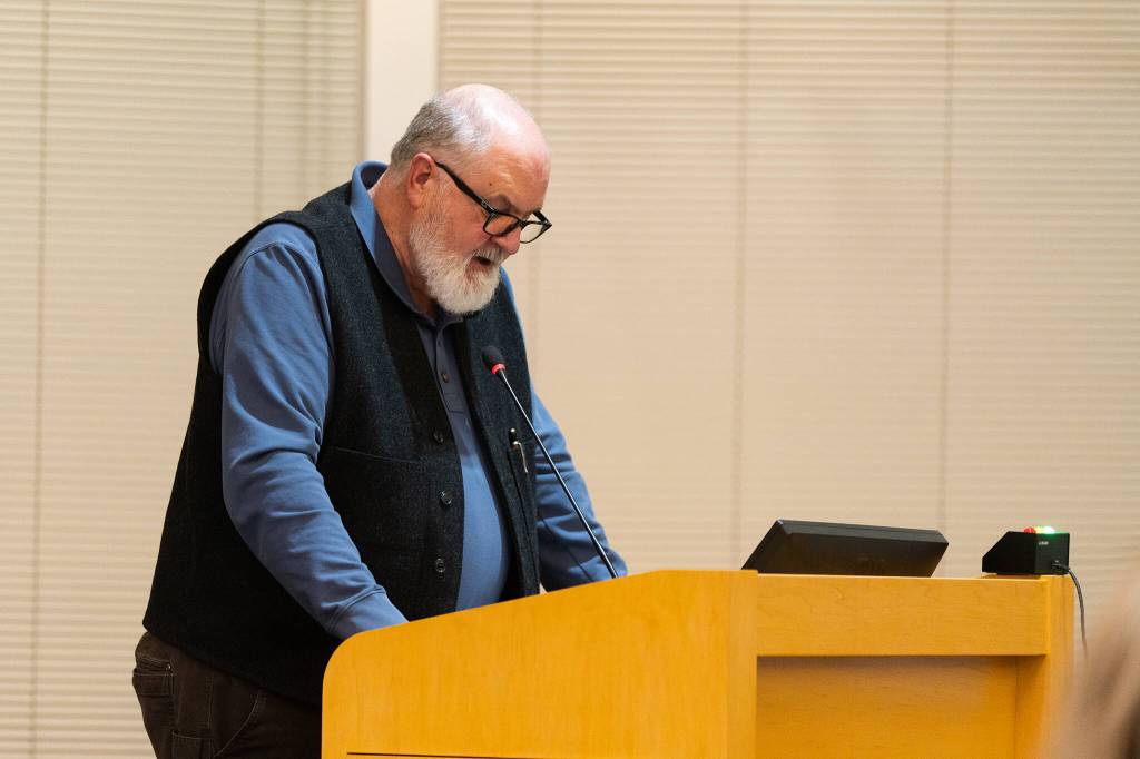 John Brock, a member of the Edmonds Environmental Council, speaks at the Edmonds City Council meeting on Tuesday, Jan. 6 in Edmonds, Washington. (Will Geschke / The Herald)