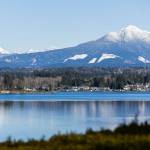 The peaks of Mount Pilchuck, left, and Liberty Mountain, right, are covered in snow on Wednesday, Feb. 12, 2025 in Lake Stevens, Washington. (Olivia Vanni / The Herald)