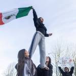 Venecia Cruz, a senior at Everett High School, yells and waves a Mexican flag during a walkout rally in protest of ICE outside of the Snohomish County Courthouse on Tuesday, Jan. 13, 2026, in Everett, Washington. (Olivia Vanni / The Herald)