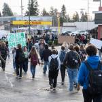 Students from Everett High School walk onto Broadway Avenue during a walkout from the high school in protest of ICE on Tuesday, Jan. 13, 2026, in Everett, Washington. (Will Geschke / The Herald)