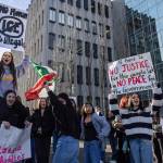 Everett High School students cheer as a car honks during a walkout rally in protest of ICE outside of the Snohomish County Courthouse on Tuesday, Jan. 13, 2026, in Everett, Washington. (Olivia Vanni / The Herald)