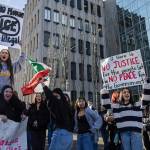 Everett High School students cheer as a car honks during a walkout rally in protest of ICE outside of the Snohomish County Courthouse on Tuesday, Jan. 13, 2026 in Everett, Washington. (Olivia Vanni / The Herald)