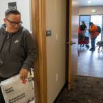 Tina Mandella, the operations director for Family Resource Centers, grabs a car bag for Bill Green at the Sky Valley Community Resource Center on Wednesday, Jan. 14, 2026 in Sultan, Washington. (Olivia Vanni / The Herald)