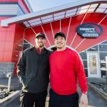 Tommys Express Car Wash owners Clayton Wall, left, and Phuong Truong, right, outside of their car wash on Friday, Jan. 16, 2026 in Everett, Washington. (Olivia Vanni / The Herald)